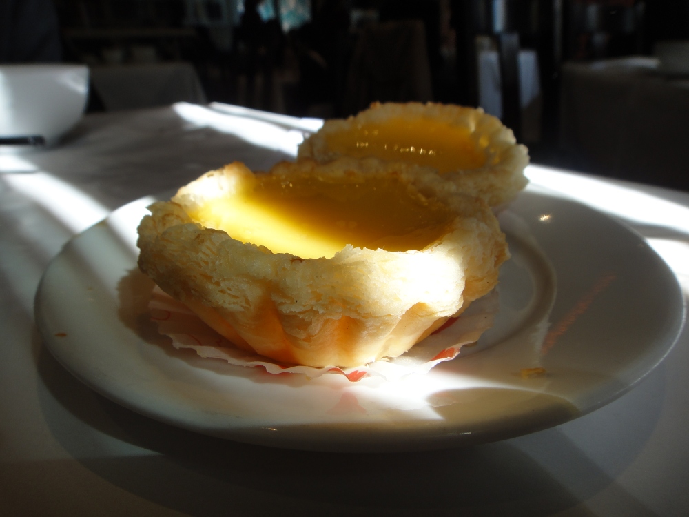 A ray of sunlight falls over an egg tart. Who doesn't like a good, sweet egg tart? Photo: Sue C.