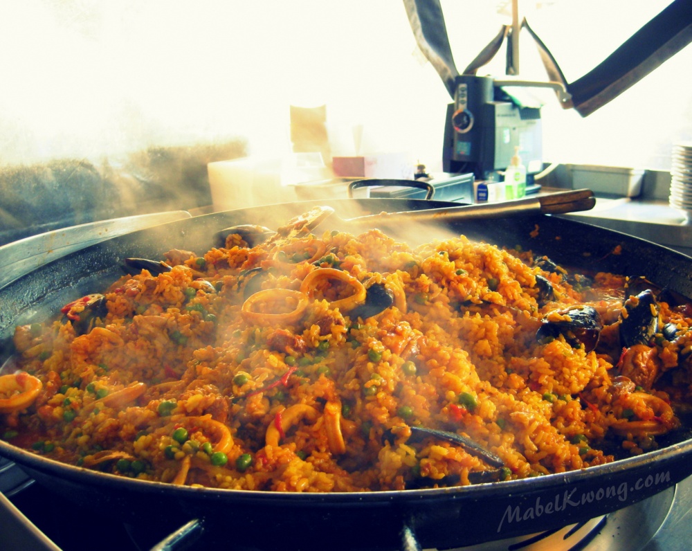 Seafood paella inside a hot pan on the street. Dare eat it? | Weekly Photo Challenge: Inside.