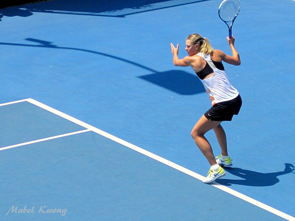 Maria Sharapova hits whizzing tennis balls during Australian Open tennis practice.